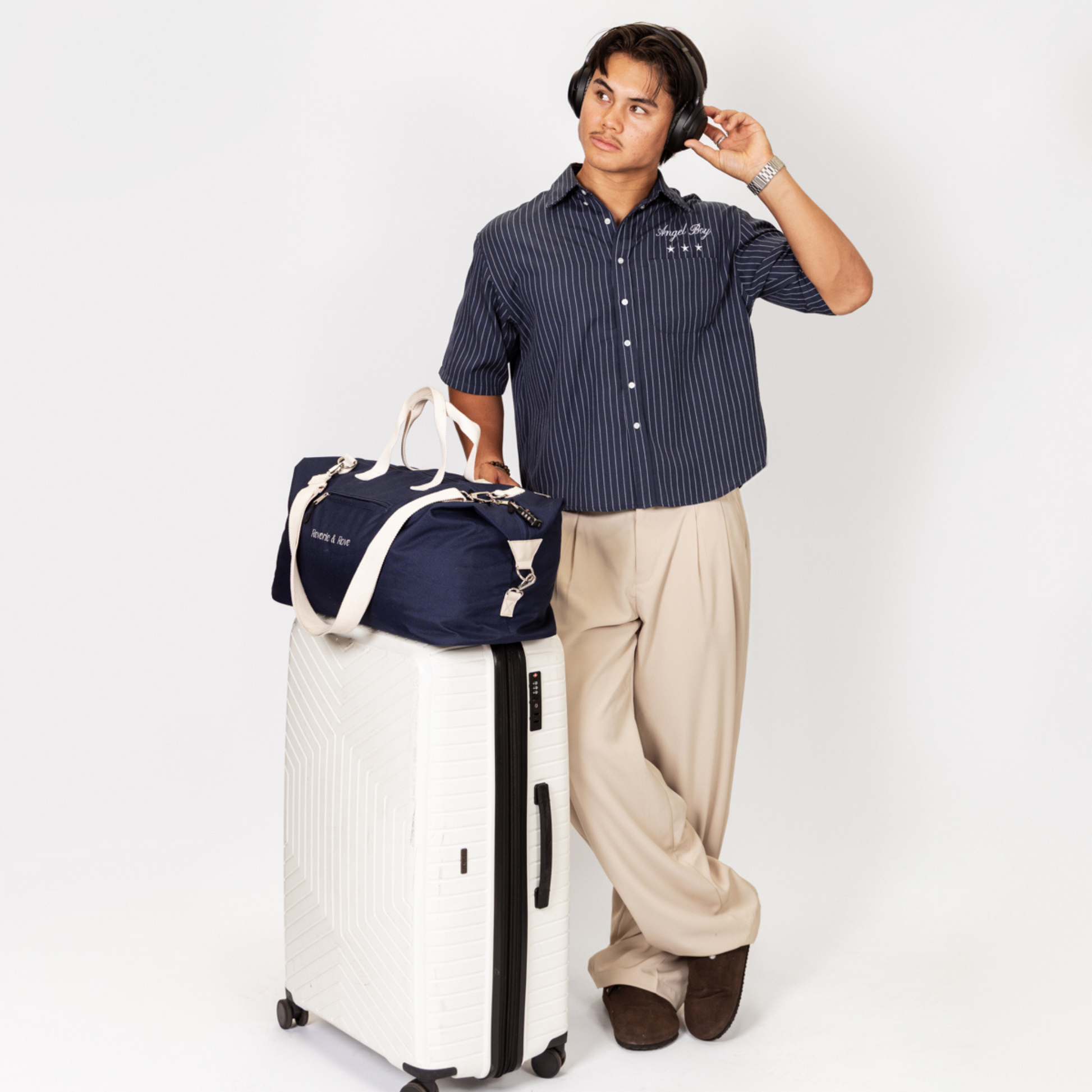 Navy duffle bag packed travel with model
