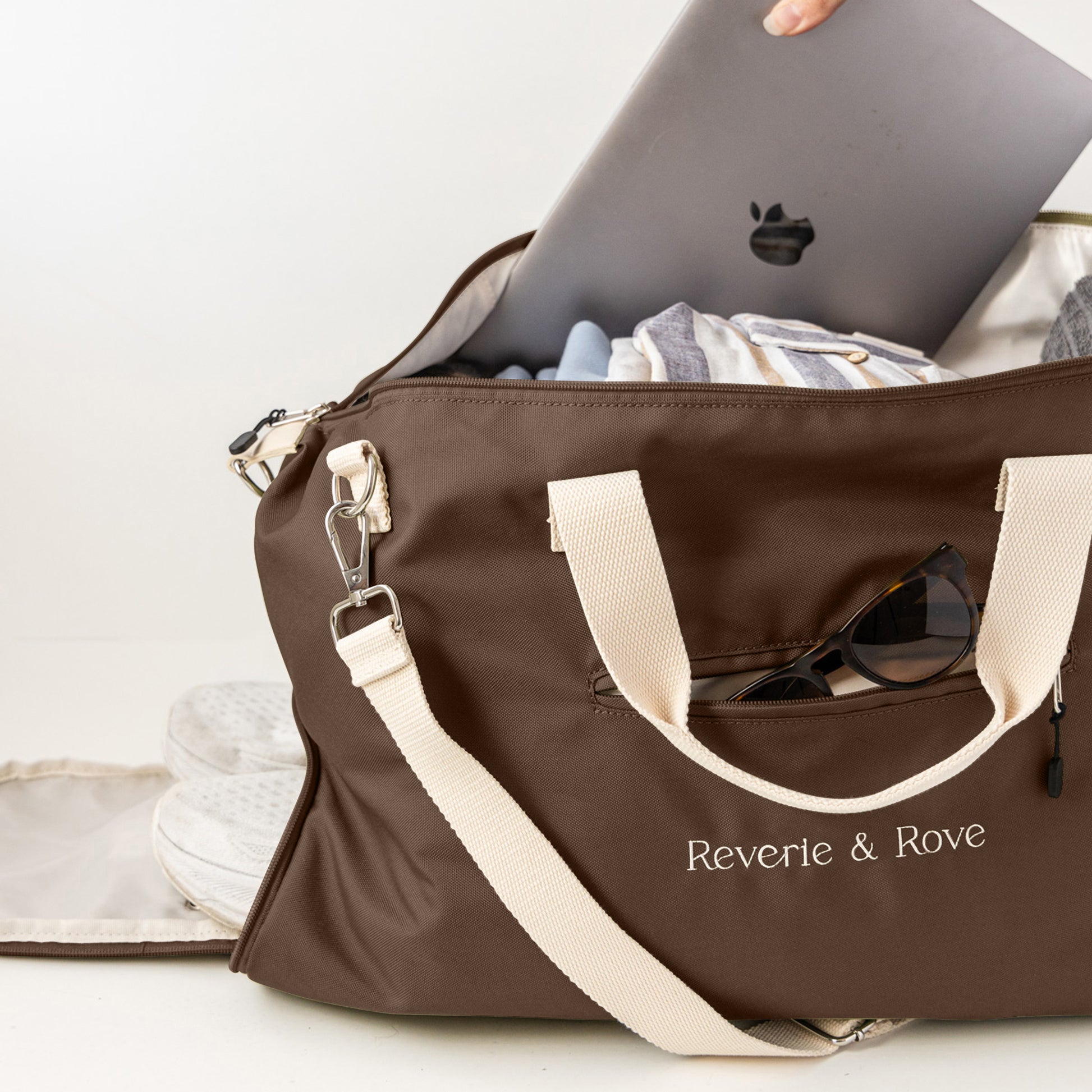 Chocolate duffle bag pack for work and travel showing multiple features