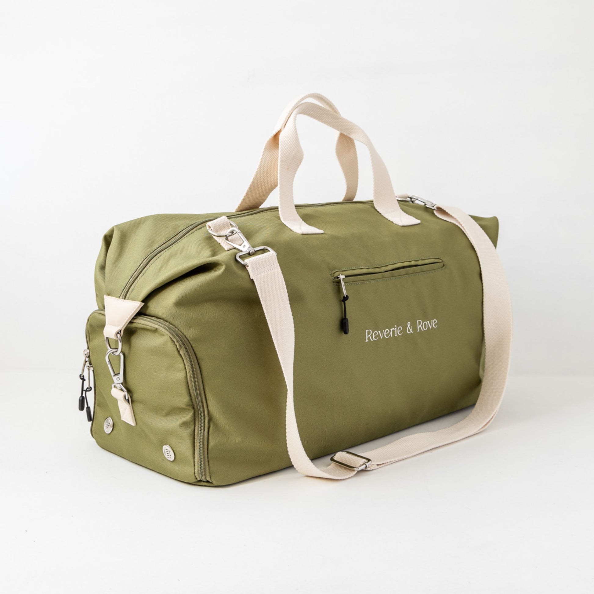 Left side profile of duffle bag with shoe compartment zipped up