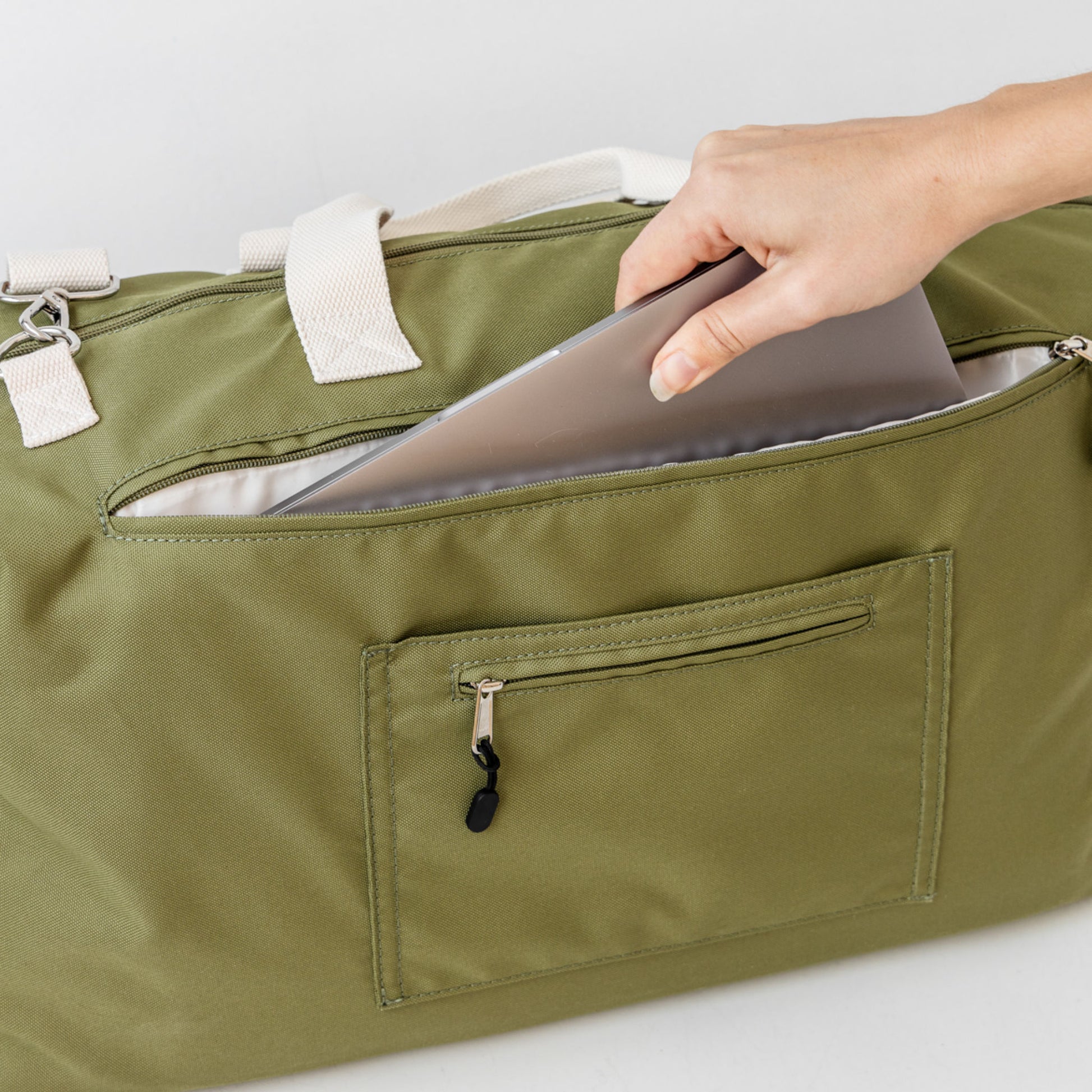 Back of duffle bag with 15" padded laptop compartment